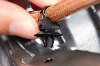 1-delig kabelbinderbevestigingselement met spreidanker en schotel voor ronde gaten.
